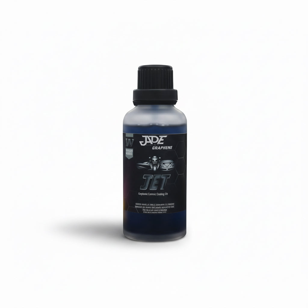 Bottle of JADE Graphene Jet product on a car detailing workbench with tools in the background.